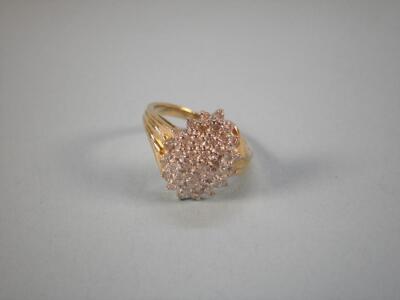 A gold and diamond set ring (oval)