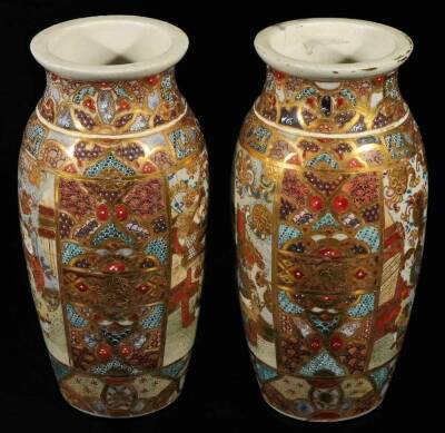 A pair of Meiji period Japanese pottery Satsuma vases, each of shouldered form, profusely decorated with panels of figures in an exterior setting, broken by a geometric pattern predominately in orange, blue and green with gilt highlights, unmarked, 21cm H - 2