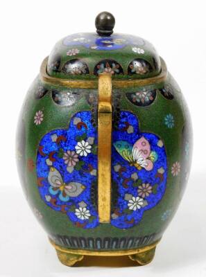 A 20thC cloisonné two handled sugar bowl, of bombe form, with shaped handles, the centre profusely decorated with flowers, on a green and black ground predominately in blue, green and yellow, on shaped feet, unmarked, 14cm H. - 4