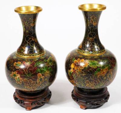 A pair of 20thC Chinese cloisonné vases, each of bulbous form with inverted trumpet stems, profusely decorated with flowers predominately in orange, green and blue, on circular feet, unmarked, 19cm H, with bases, etc. (a quantity) - 2