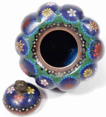 An early 20thC Chinese cloisonné jar and cover, of melon shape, with domed lid, profusely decorated with flowers predominately in red, pink and white on a blue and turquoise ground, on triple shaped feet, 12cm H. - 3