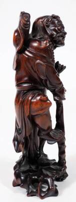 An early 20thC Chinese root carving, of a bearded sage in flowing robes holding staff in a naturalistic setting, 28cm H. - 4