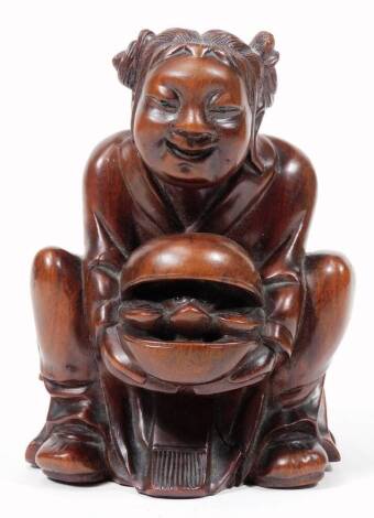 A 19thC Japanese wooden carving, of a boy holding turtle, from a famous legend, 13cm H.