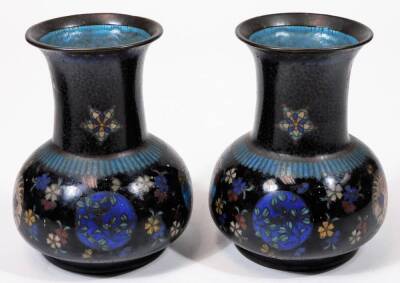 A pair of early 20thC Chinese cloisonné vases, each of shouldered circular form, decorated with flowers predominately in blue, green and white, with a further pair of cloisonné open vases with cylindrical stems and compressed domed bodies. (4) - 2