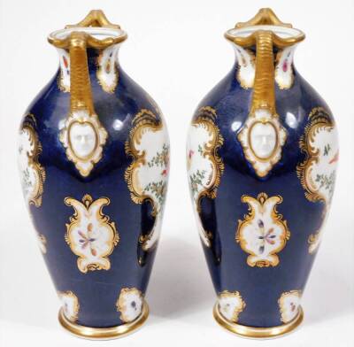 A pair of early 20thC Grainger & Co Worcester porcelain exotic bird pattern vases, each decorated with panels of birds and garlands, predominately in pink, yellow and green on blue grounds with gilt highlights, marked beneath, 23cm H. - 2