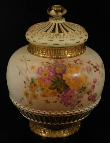 A early 20thC Royal Worcester blush ivory porcelain potpouri jar, cover and liner, no.1286, the circular body handpainted with flowers predominately in pink, yellow and green, on a circular foot, 1903, 32cm H.