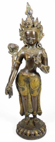 A classical bronze and gilt metal figure, possibly Guan Yin, in elaborate dress on a pierced domed circular base, 52cm H.