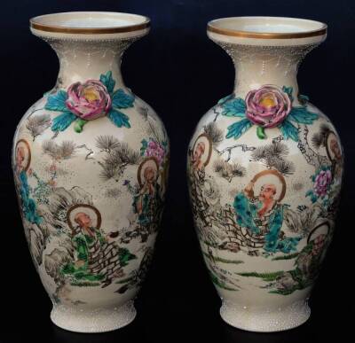 A pair of Japanese pottery Kyoto Meiji period vases, each with compressed trumpet stems and shouldered bodies, raised with a flowerhead and leaves, profusely decorated with figures in flowing robes, predominately in turquoise and yellow with gilt highligh - 2