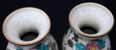 A pair of Japanese pottery Kyoto Meiji period vases, each with compressed trumpet stems and shouldered bodies, raised with a flowerhead and leaves, profusely decorated with figures in flowing robes, predominately in turquoise and yellow with gilt highligh - 5