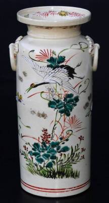 A Japanese pottery Kyoto type pottery vase, of turned form with moulded handles, the main body decorated with crane, butterfly and flowers, predominately in pink, green, yellow and red, with a double line lower banding and upper floral banding, signed, 2 - 3