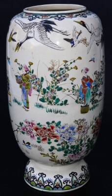 A Japanese Meiji period Kyoto type pottery vase, the shaped body decorated with crane, figures and flowers, predominately in orange, green and blue, with further insects beneath, on a circular domed foot, 30cm H. - 2