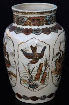 A 19thC Japanese Meiji period Satsuma vase, the shouldered circular body decorated with panels set with samurai, birds, flowers and wild cats, with an upper floral banding and lower geometric border, typically decorated with gilt highlights, unmarked, 25c - 2