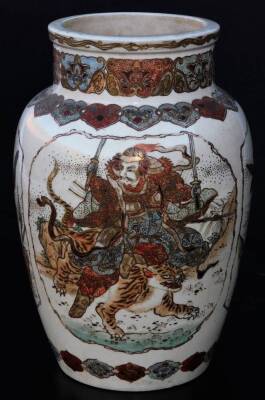 A 19thC Japanese Meiji period Satsuma vase, the shouldered circular body decorated with panels set with samurai, birds, flowers and wild cats, with an upper floral banding and lower geometric border, typically decorated with gilt highlights, unmarked, 25c - 3