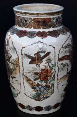 A 19thC Japanese Meiji period Satsuma vase, the shouldered circular body decorated with panels set with samurai, birds, flowers and wild cats, with an upper floral banding and lower geometric border, typically decorated with gilt highlights, unmarked, 25c - 4