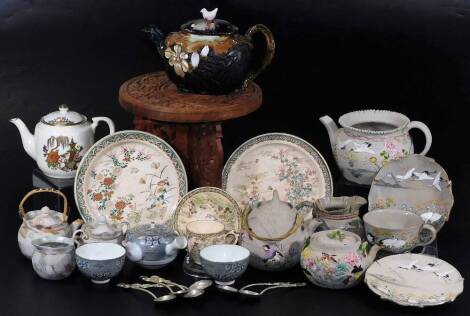 Various Japanese pottery and effects, a similar pair of Satsuma plates, a teapot and saucer, 11cm Dia., small wooden table, teapot decorated with Kutani crane, base metal teaspoons, kettles, teapots, other ornaments, etc. (a quantity)