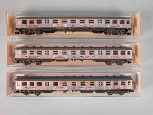 A set of three Fleischmann Piccolo N gauge carriages in silver with a narrow