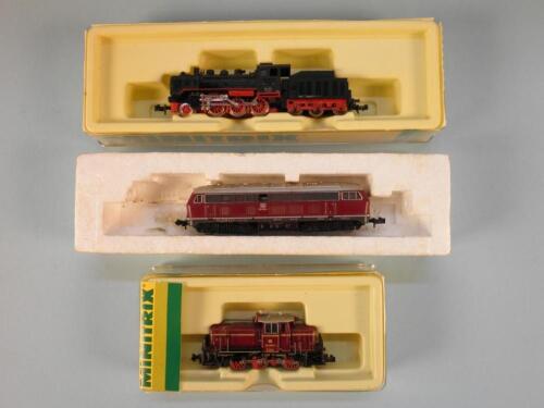 A Minitrix N gauge shunter in dark red and black