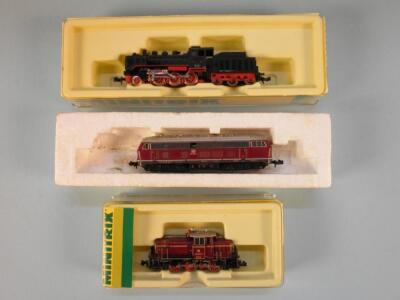 A Minitrix N gauge shunter in dark red and black