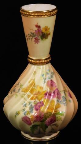 A late 19thC Royal Worcester blush ivory vase, 1898, with slender tapering stem and ribbed body handpainted with posies, with gilt highlights, on circular foot, marked beneath, 17cm H.