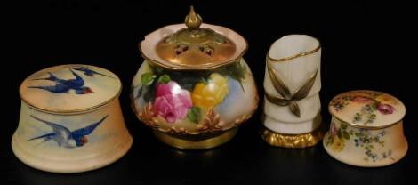 An early 20thC Royal Worcester pot pourri vase and cover, 1911, with pierced lid, bellied circular body, handpainted with roses, on a circular foot, 6cm H, a miniature vase, no. 1049, a lidded jar and cover and another decorated with swallows. (4, AF)