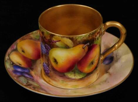 A 20thC Royal Worcester porcelain cabinet cup and saucer, 1925, by Reginald Austin, handpainted with autumnal fruits, printed marks beneath, the can 5cm H.