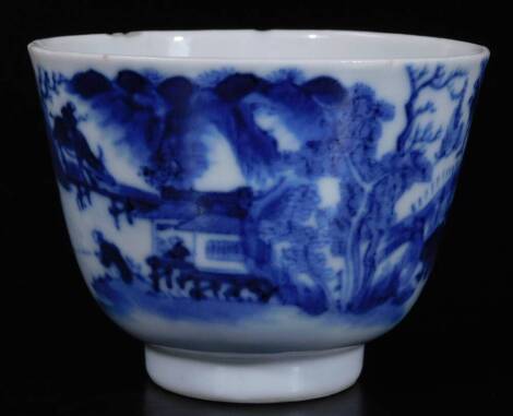 A Chinese blue and white porcelain tea bowl, of tapering form on circular foot, profusely decorated with fisherman before buffalo, six character Kangxi style mark beneath, 6cm H.