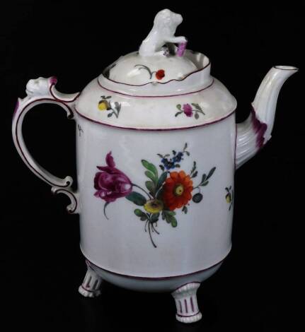 An early 19thC Ludwigsburg porcelain coffee pot, with animal knop, shaped cylindrical body and mask S scroll handle, on turned feet, handpainted with flowers predominately in pink, green and orange, crown and inverted double C mark beneath, c1810, 25cm H.