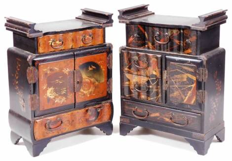 An early 20thC Japanese black lacquer Shodhana type cabinet, set with raised figures, the scroll top with a central drawer above double cupboard and further drawer beneath, on stylised bracket feet, 37cm H, 25cm W, 13cm D and another similar. (2)