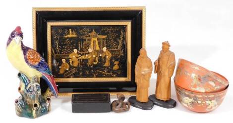 A 19thC 20thC Japanese lacquered panel, set with many figures before buildings, with gilt highlights, 12cm x 16cm, an entwined netsuke type python, two orange bowls, a carved wooden figure of a Chinese gentleman standing wearing flowing robes, another of 