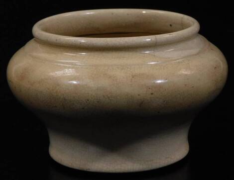 A Ming type pottery bowl, of bellied circular form, on circular foot, cream decorated, unmarked, 8cm H.