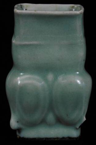 A Chinese Celadon pottery vase, of floral form, on oval foot, labelled beneath Ming Sky Blue Vase, 10cm H.