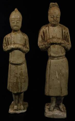 A matched pair of terracotta tomb style figures, of a Chinese lady and gentleman in flowing robes, on shaped bases, 33cm H. (2)