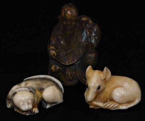 Two early 20thC Japanese netsuke, comprising a sleeping cat and a mouse and a further similar figure of a sage, 6cm H. (3)