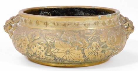 A Chinese bronze censer, of bellied circular form, profusely decorated with an upper Greek key style banding and mask handles, bearing six character Xuande reign mark beneath, 21cm W. Auctioneer Announce new dimension.