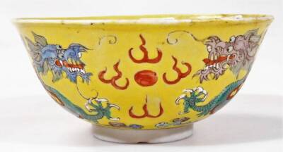 A Chinese pink enamel bowl of circular form, decorated with panels of flowers, 6cm H and a Chinese famille jaune bowl. (2) - 7