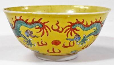 A Chinese pink enamel bowl of circular form, decorated with panels of flowers, 6cm H and a Chinese famille jaune bowl. (2) - 9