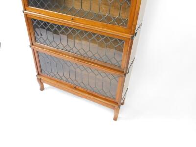 An early 20thC Globe Wernicke mahogany four section bookcase, with astragal glazed up and over doors, raised on cabriole legs, 141cm H, 86cm W, 27.6cm D. - 3