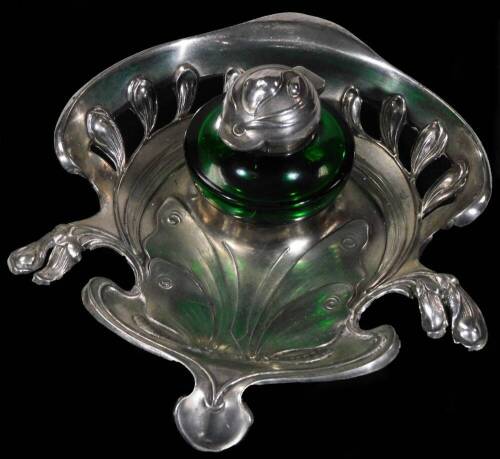 An early 20thC WMF Art Nouveau inkstand, with shaped flowerhead base and removable green glass ink bottle, with floral head, numbered 267 beneath, 17cm W.