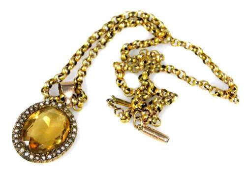 A Victorian citrine and pearl necklace, the oval pendant set with central citrine, surrounded by seed pearls, in a yellow metal frame, stamped G C & Co, unmarked, on a belcher link chain, yellow metal, clasp stamped 9c, the pendant 3.5cm H, the chain, 44c