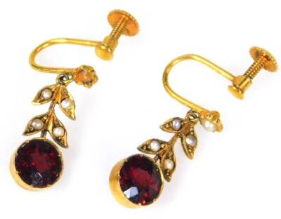 A pair of garnet and seed pearl drop earrings, with round cut garnet, with vine design four strand leaf drop, each set with seed pearl, in yellow metal frames, unmarked, 2.2cm H, 3g all in.