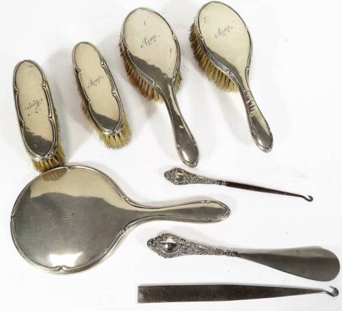 A George V silver dressing table set, comprising two hair brushes, 25cm W, two clothes brushes and a hand mirror, marked Annie, and a small quantity of other silver dressing table items, mainly Birmingham 1926. (a quantity)