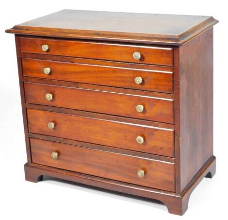 A 19thC mahogany apprentice piece table top chest, of five long drawers, each with ivory knop handles, on bracket feet, 31cm H, 32cm W, 18cm D.