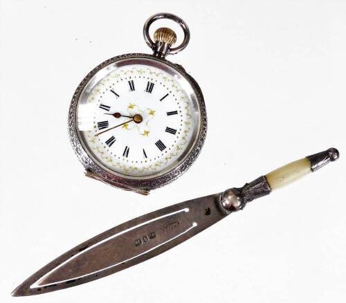 A Victorian silver bookmark, of trowel form, Birmingham 1890, 9cm W, and a Continental open fob watch with fancy Roman numeric dot dial, in engine turned case marked 0.935, white metal. (2)