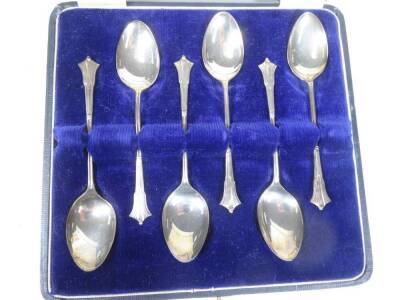 A George III silver caddy spoon, Fiddle pattern, with shaped partially etched bowl, Birmingham 1816, 9cm W, and a cased set of six teaspoons stylised Onslow pattern, 4oz. - 2