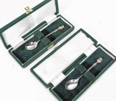 An Elizabeth II silver James Usher Lincoln Imp spoon 1977, 13cm W (cased), and another with one certificate. (2)