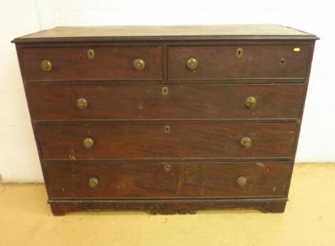 A George III mahogany chest of two short and three long drawers on bracket feet