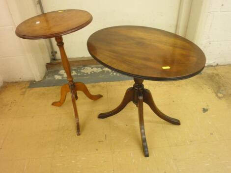 A mahogany oval occasional table on four splay legs and a burr