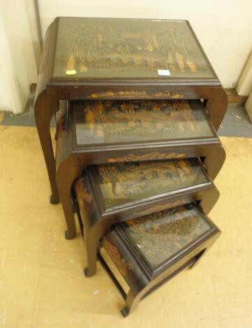 A nest of four carved Eastern hardwood tables