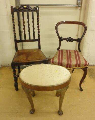 An oval walnut dressing stool with a padded seat on cabriole legs with pad feet