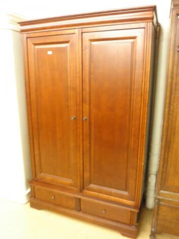 A modern cherry veneered wardrobe with two panelled doors above